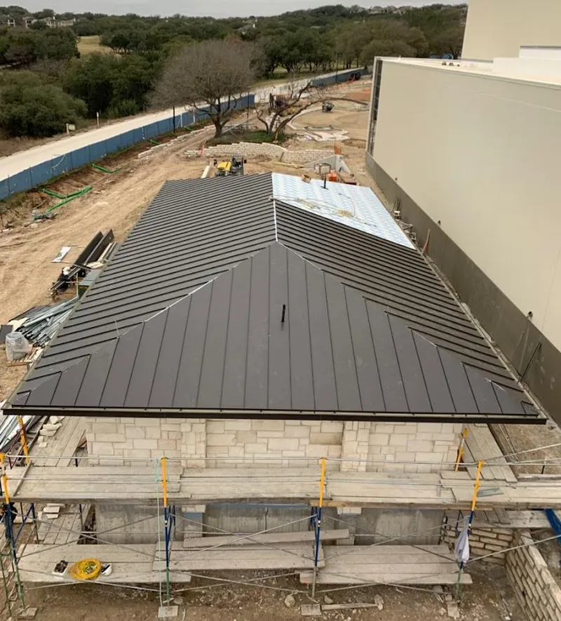 Metal roof new construction with scaffolding in Rose